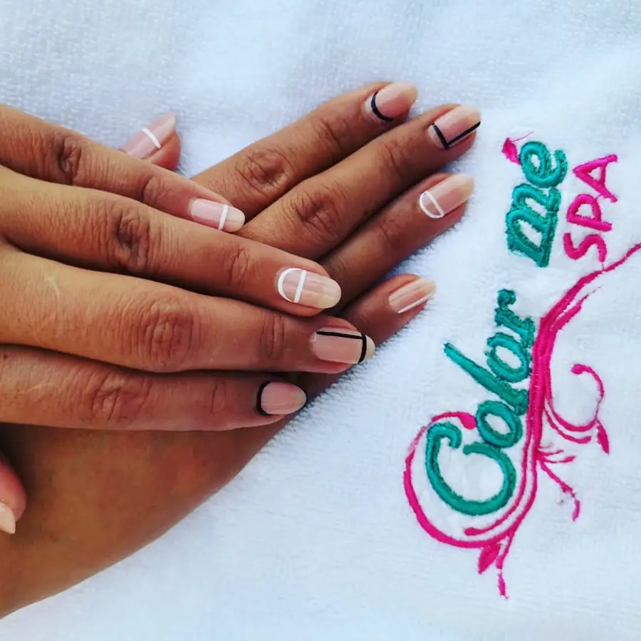 A finished manicure on a Color Me Spa towel